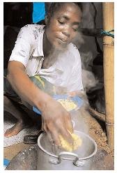 Many Africans depend on some variation of this mush, which is made with water and ground maize. It can be eaten as a porridge or a dumpling, depending on the thickness of the batter and the cooking method. [AP/Wide World Photos. Reproduced by permission.]